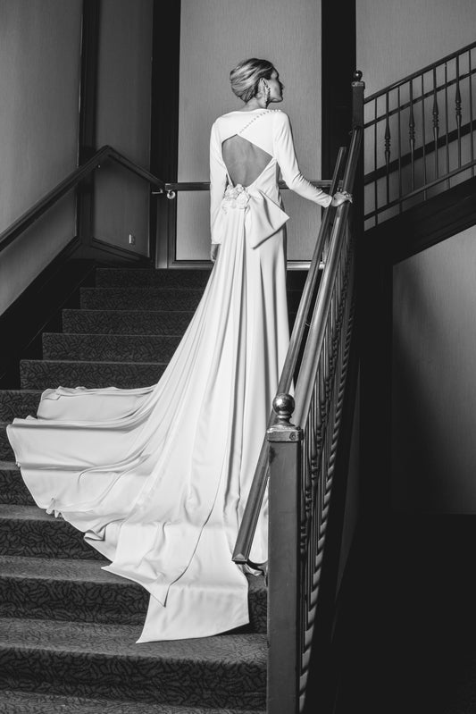 THE PRETTY LADY - FITTED CREPE GOWN WITH SLEEVES AND BOW TRAIN DETAIL
